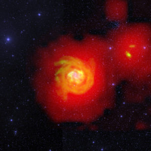 Een samengestelde afbeelding van het sterrenstelsel waar de rivier naartoe leidt. In het midden vormt het stelsel nieuwe sterren (blauw). Het stelsel bevat veel dicht opeengepakt waterstof (oranje). Het ijle waterstof dat van de kleine stelsels naar NGC 6946 stroomt, is rood gekleurd. Credit: D.J. Pisano (WVU); B. Saxton (NRAO/AUI/NSF); Palomar Observatory - Space Telescope Science Institute 2nd Digital Sky Survey (Caltech); Westerbork Synthesis Radio Telescope