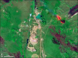 Satellietbeeld van de Catoca-mijn in Angola.  Bron: Wikimedia Commons