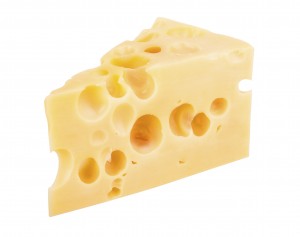 Wat veroorzaakt de gaten in kaas?